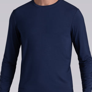Model wearing Paramount Legion Blue long sleeve Icy Bamboo® crewneck, styled in gray pants.
