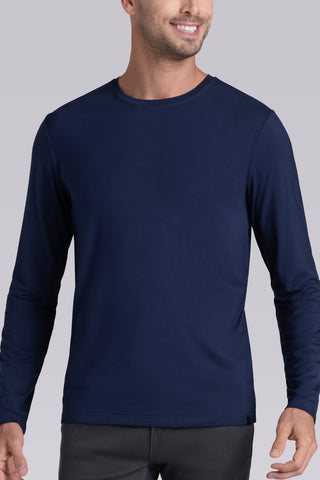 Model wearing Paramount Legion Blue long sleeve Icy Bamboo® crewneck, styled in gray pants.