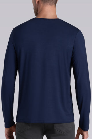 Model wearing Paramount Legion Blue long sleeve Icy Bamboo® crewneck, styled in gray pants.