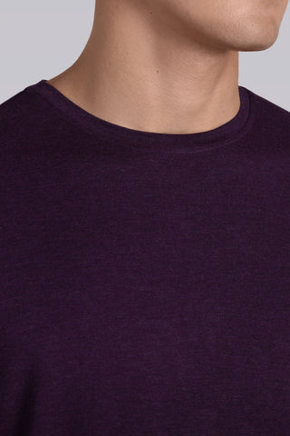 Model wearing Paramount Plum Heather long sleeve Icy Bamboo® crewneck, styled in black pants.