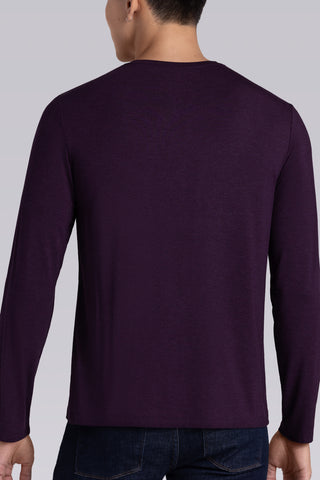 Model wearing Paramount Plum Heather long sleeve Icy Bamboo® crewneck, styled in black pants.