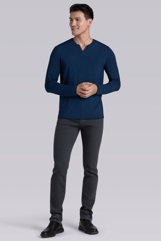 Model wearing Zen Lagoon Blue Icy Bamboo® long sleeve crewneck t-shirt, styled with grey pants.