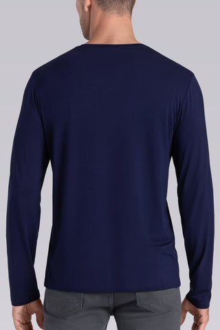 Model wearing Zen Navy Icy Bamboo® long sleeve crewneck t-shirt, styled with grey pants.