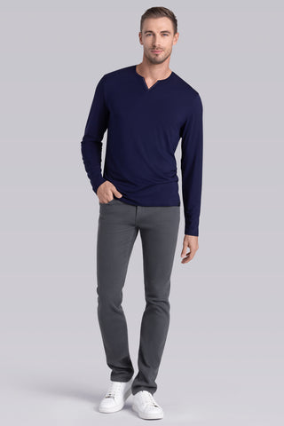 Model wearing Zen Navy Icy Bamboo® long sleeve crewneck t-shirt, styled with grey pants.