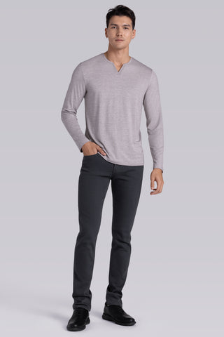 Model wearing Zen Oak Tree Heather Icy Bamboo® long sleeve crewneck t-shirt, styled with grey pants.
