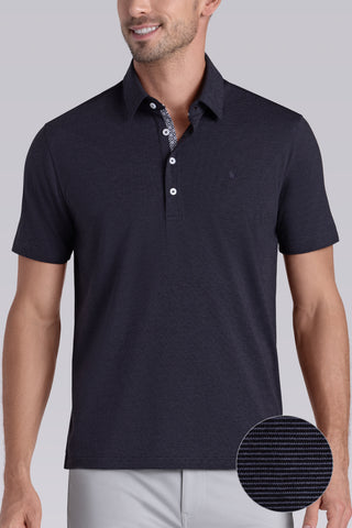 Model wearing Clubhouse Charcoal Icy Cotton® short sleeve polo, styled with light grey pants.
