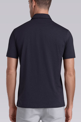Model wearing Clubhouse Charcoal Icy Cotton® short sleeve polo, styled with light grey pants.