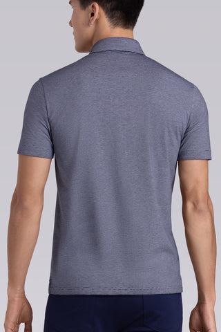 Model wearing Clubhouse Navy Icy Cotton® short sleeve polo, styled with navy pants.
