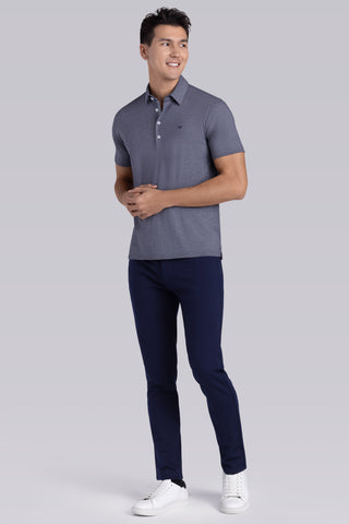 Model wearing Clubhouse Navy Icy Cotton® short sleeve polo, styled with navy pants.