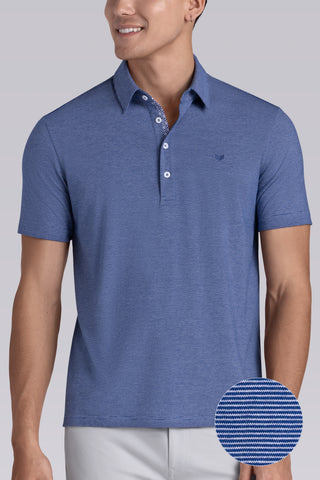 Model wearing Clubhouse Vintage Blue Icy Cotton® short sleeve polo, styled with white pants.