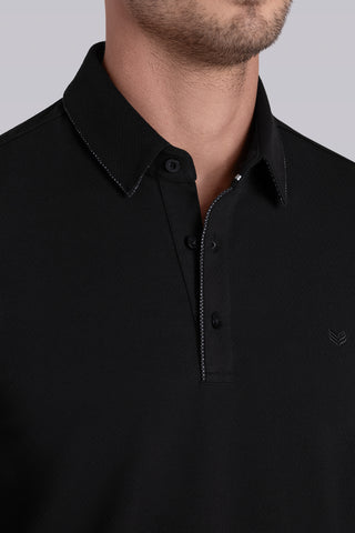 Model wearing Class Black long sleeve Icy Cotton® Jaquard Polo, styled with white pants.
