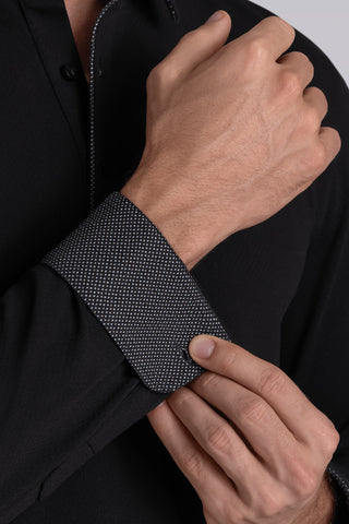Model wearing Class Black long sleeve Icy Cotton® Jaquard Polo, styled with white pants.