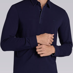 Model wearing Class Navy long sleeve Icy Cotton® Jaquard Polo, styled with light grey pants.