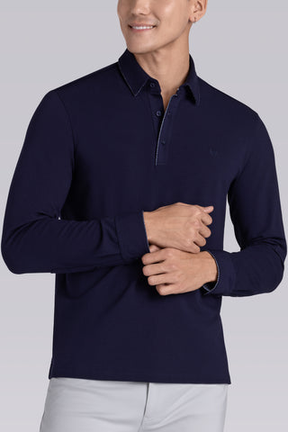 Model wearing Class Navy long sleeve Icy Cotton® Jaquard Polo, styled with light grey pants.