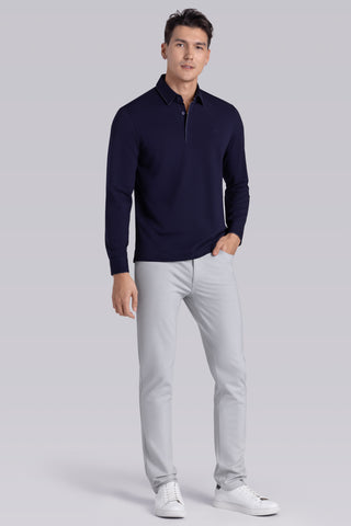Model wearing Class Navy long sleeve Icy Cotton® Jaquard Polo, styled with light grey pants.