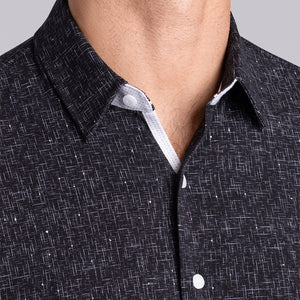 Model wear Integrity Black Icy Cotton® long sleeve classic collar shirt, styled with white pants.