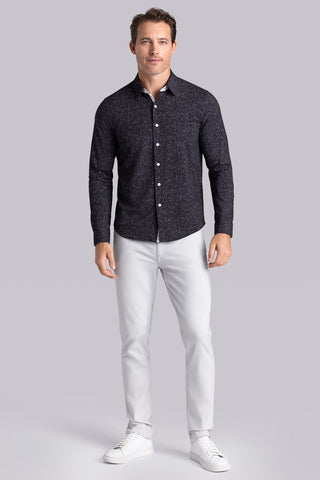 Model wear Integrity Black Icy Cotton® long sleeve classic collar shirt, styled with white pants.