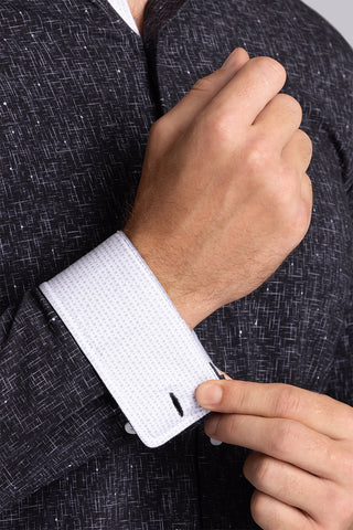 Model wear Integrity Black Icy Cotton® long sleeve classic collar shirt, styled with white pants.