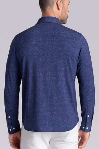 Model wear Integrity Navy Icy Cotton® long sleeve classic collar shirt, styled with white pants.