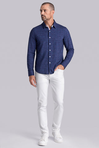 Model wear Integrity Navy Icy Cotton® long sleeve classic collar shirt, styled with white pants.