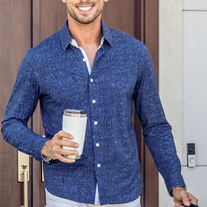 Model wear Integrity Navy Icy Cotton® long sleeve classic collar shirt, styled with white pants.