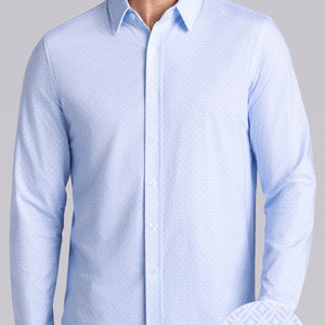 Model wearing Echo Haze Blue long sleeve tonal geometric print shirt, styled with black pants.