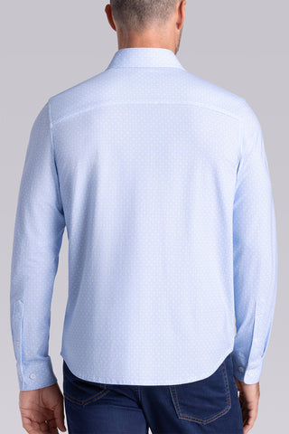Model wearing Echo Haze Blue long sleeve tonal geometric print shirt, styled with black pants.