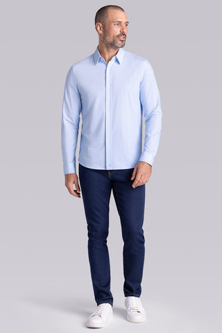 Model wearing Echo Haze Blue long sleeve tonal geometric print shirt, styled with black pants.