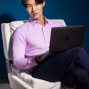 Model wearing the Elusive Pink long sleeve dress shirt, styled with fitted black dress slacks.