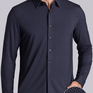 Model wearing the Excelsior Black Ink long sleeve dress shirt, styled with fitted black dress slacks.