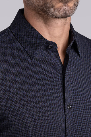 Model wearing the Excelsior Black Ink long sleeve dress shirt, styled with fitted black dress slacks.