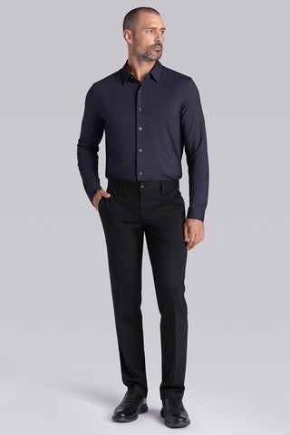 Model wearing the Excelsior Black Ink long sleeve dress shirt, styled with fitted black dress slacks.