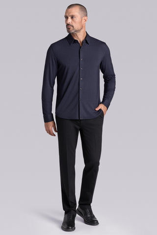 Model wearing the Excelsior Black Ink long sleeve dress shirt, styled with fitted black dress slacks.