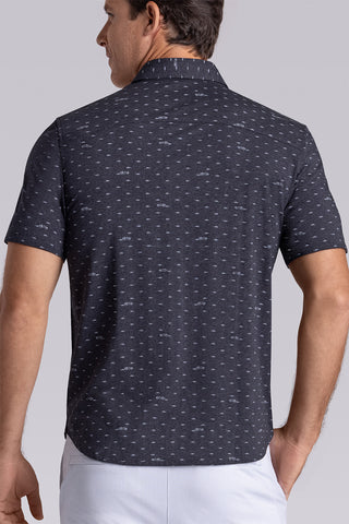 Model wearing Drift Charcoal Heather short sleeve car print shirt, styled with white shorts