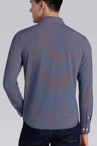 Model wearing Spry Navy Taupe long sleeve shirt with built in classic collar with geometric print, styled with jeans pants.