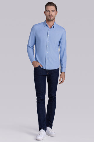 Model wearing Spry Ocean Blue long sleeve shirt with built in classic collar with geometric print, styled with jeans pants.