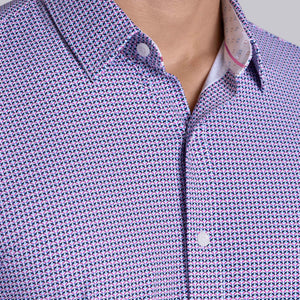 Model wearing Spry Pink long sleeve shirt with built in classic collar with geometric print, styled with jeans pants.
