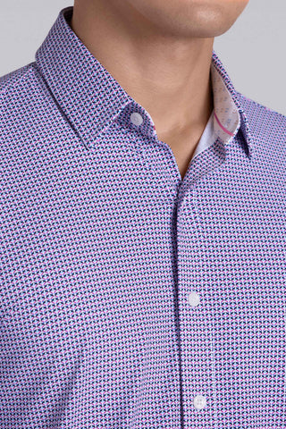 Model wearing Spry Pink long sleeve shirt with built in classic collar with geometric print, styled with jeans pants.