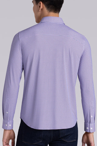 Model wearing Spry Pink long sleeve shirt with built in classic collar with geometric print, styled with jeans pants.