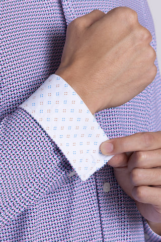 Model wearing Spry Pink long sleeve shirt with built in classic collar with geometric print, styled with jeans pants.