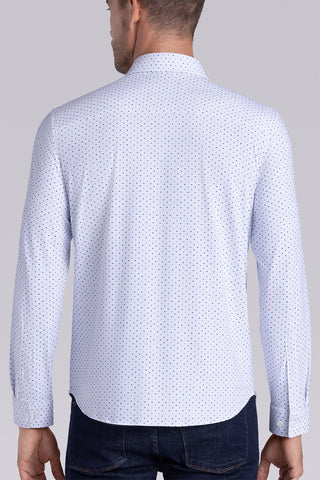 Model wearing Committed White Navy long sleeve shirt with built in classic collar with geometric print, styled with jeans.