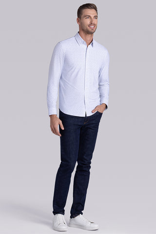 Model wearing Committed White Navy long sleeve shirt with built in classic collar with geometric print, styled with jeans.