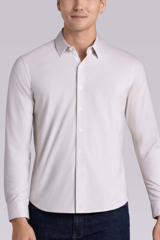 Model wearing Strive Light Taupe Icy Cotton® long sleeve shirt with classic collar and french placket, styled with black pants