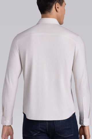 Model wearing Strive Light Taupe Icy Cotton® long sleeve shirt with classic collar and french placket, styled with black pants