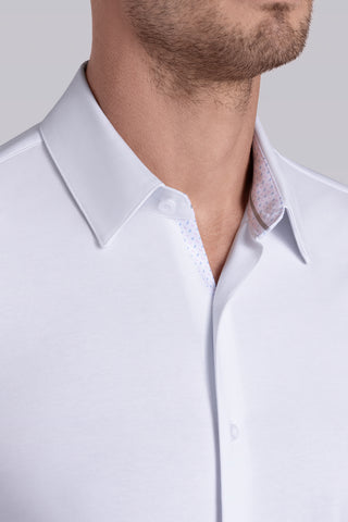 Model wearing Strive White Icy Cotton® long sleeve shirt with classic collar and french placket, styled with khaki pants