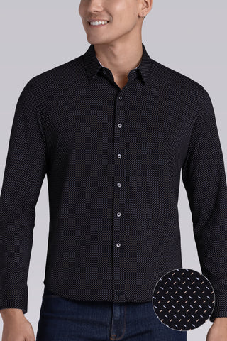 Model wearing Ignite Black Icy Cotton® long sleeve shirt with classic collar and placket, styled with navy pants