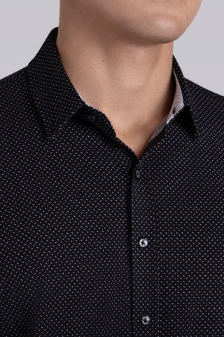 Model wearing Ignite Black Icy Cotton® long sleeve shirt with classic collar and placket, styled with navy pants