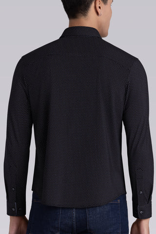 Model wearing Ignite Black Icy Cotton® long sleeve shirt with classic collar and placket, styled with navy pants