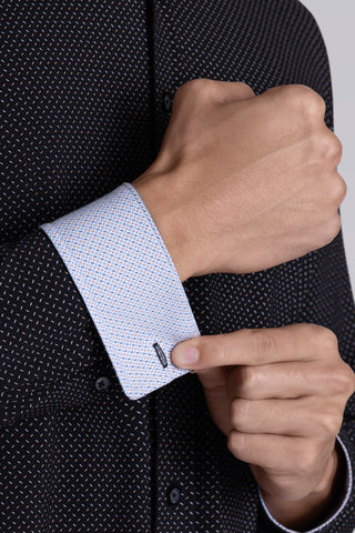 Model wearing Ignite Black Icy Cotton® long sleeve shirt with classic collar and placket, styled with navy pants
