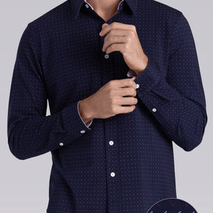 Model wearing Ignite Navy Red Icy Cotton® long sleeve shirt with classic collar and placket, styled with khaki pants